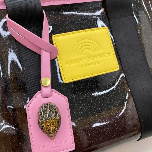 Kurt Geiger clear tote bag with large capacity, luxury design, women's fashion handbag featuring pink, black, and yellow accents.