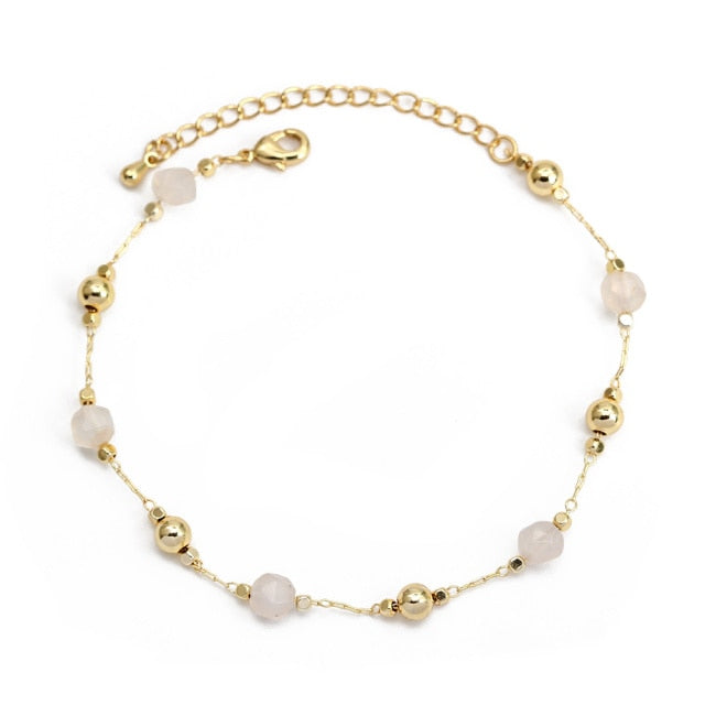 Charm BraceletIntroducing the Charm Bracelet! This beautiful bracelet is made of high quality materials, including copper, pearls, and natural stones. It's the perfect accessory tCharm Bracelet