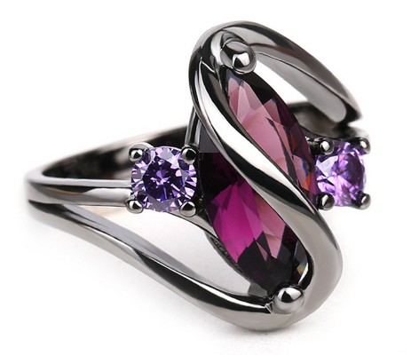 Crystal RingIntroducing the Crystal Ring â a stunning piece of jewelry that is sure to turn heads. This beautiful ring features a large red leaf crystal in the center, surrounCrystal Ring