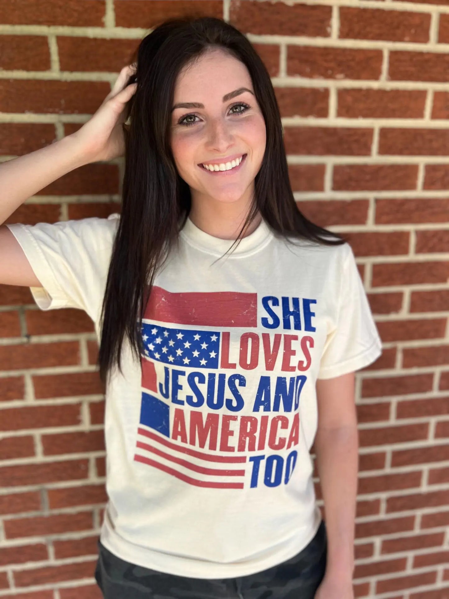 She Loves Jesus and America Too TeeAmerica and Jesus, that's all we need! This comfy tee is the perfect top for any patriotic holiday!
Model is wearing a size Small, her true size.Loves Jesus