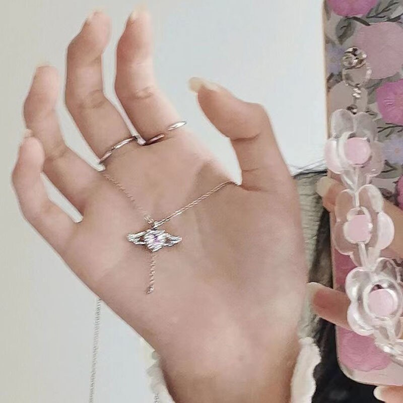 Heart Wings NecklaceMake a statement this season with our Heart Wings Necklace. This stunning piece of jewelry is designed to evoke love and emotion with its elegant heart and wings desHeart Wings Necklace