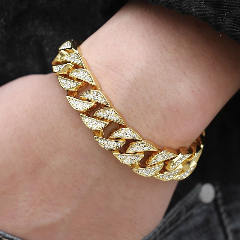 Miami Gold Curb Cuban BraceletIntroducing the Miami Gold Curb Cuban Chain Bracelet, a timeless and original piece of jewelry perfect for an elegant, sophisticated look. This beautiful bracelet isMiami Gold Curb Cuban Bracelet