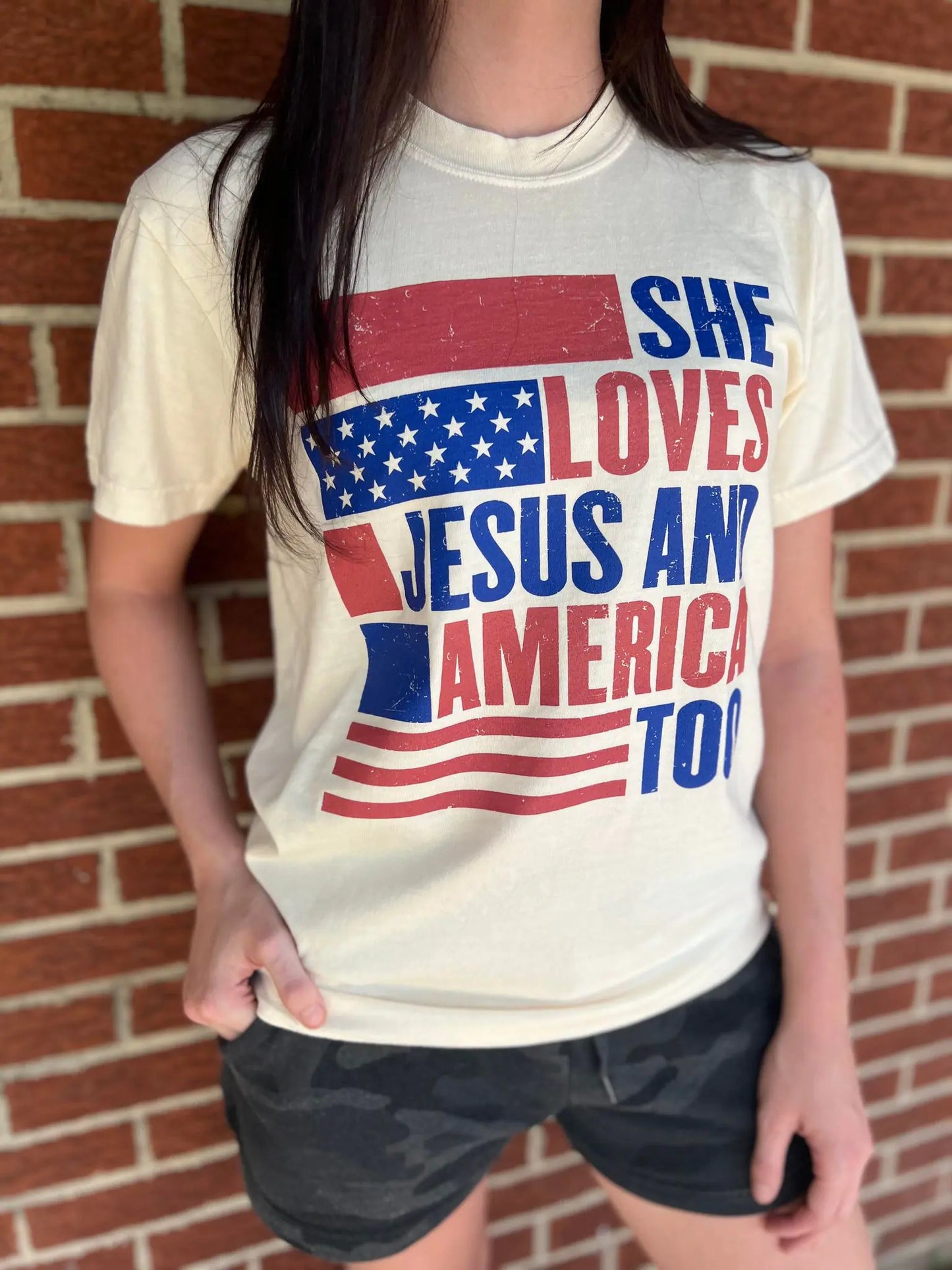 She Loves Jesus and America Too TeeAmerica and Jesus, that's all we need! This comfy tee is the perfect top for any patriotic holiday!
Model is wearing a size Small, her true size.Loves Jesus