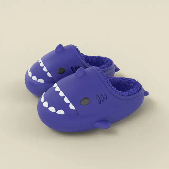 Kozyshark Fuzzy SlidesWrap your feet in comfort and style with our Kozyshark Fuzzy Slides! Designed for ultimate relaxation, these cozy slippers are the perfect companion for lazy days atKozyshark Fuzzy Slides