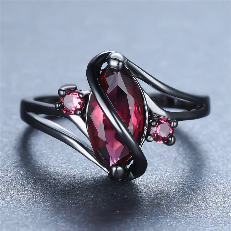 Crystal RingIntroducing the Crystal Ring â a stunning piece of jewelry that is sure to turn heads. This beautiful ring features a large red leaf crystal in the center, surrounCrystal Ring