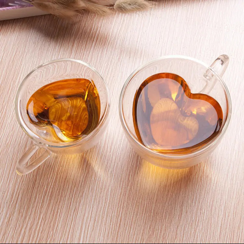 Double Wall Heart Glass CupToast to Love with Every Sip Celebrate romance with our Double Wall Heart Glass Cup. Its unique heart-shaped design and double-wall insulation keep your drinks at thDouble Wall Heart Glass Cup