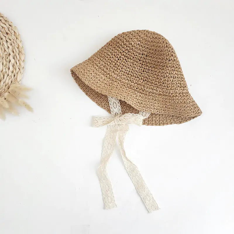 Fashion Baby HatDiscover the perfect blend of style and sun protection for your little one with our Fashion Lace Baby Hat!Chic and Sun-Safe: Made from high-quality straw and adornedFashion Baby Hat