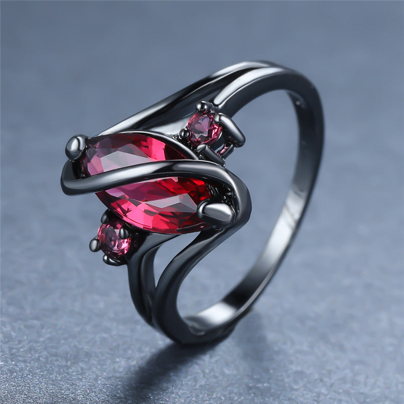 Crystal RingIntroducing the Crystal Ring â a stunning piece of jewelry that is sure to turn heads. This beautiful ring features a large red leaf crystal in the center, surrounCrystal Ring