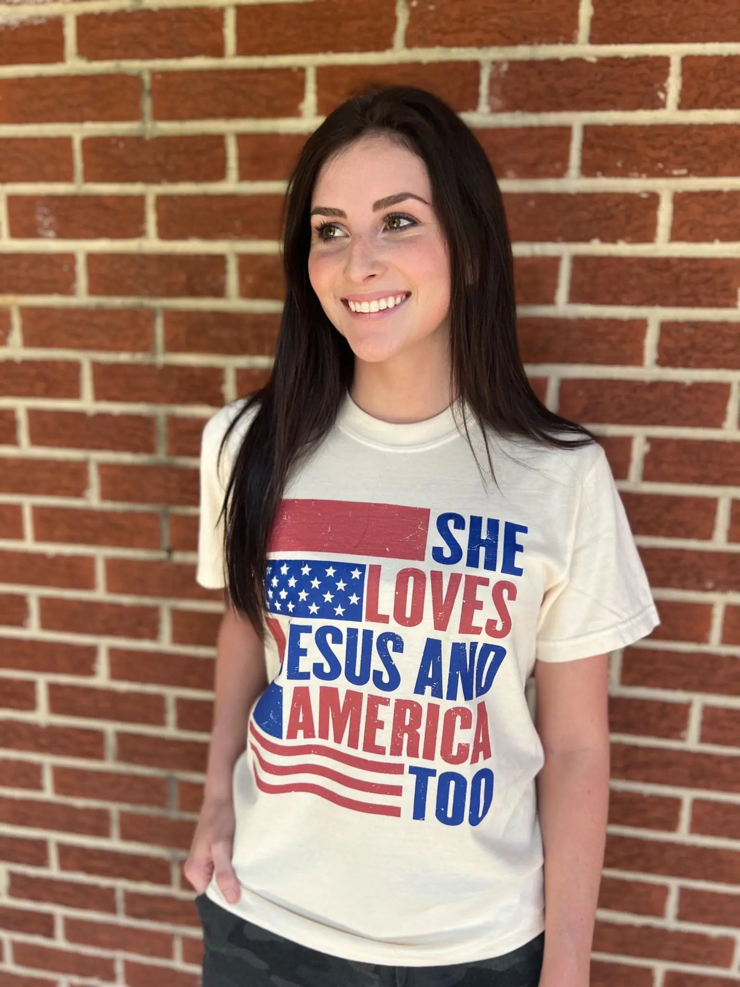 She Loves Jesus and America Too TeeAmerica and Jesus, that's all we need! This comfy tee is the perfect top for any patriotic holiday!
Model is wearing a size Small, her true size.Loves Jesus