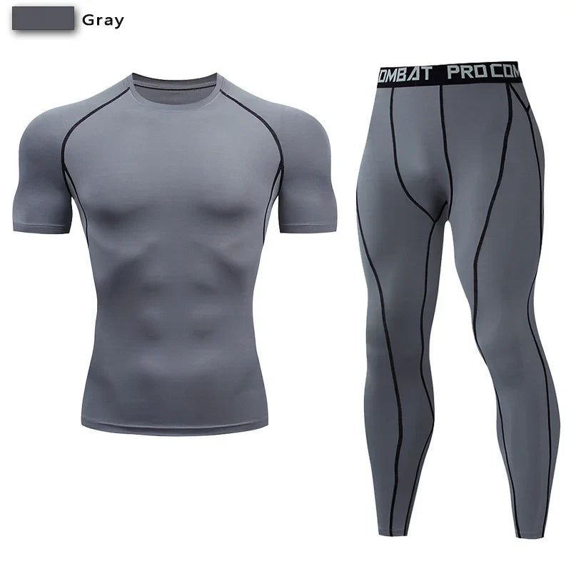 Men's gray compression sportswear suit with short-sleeve top and tight pants for gym, yoga, or MMA workouts.