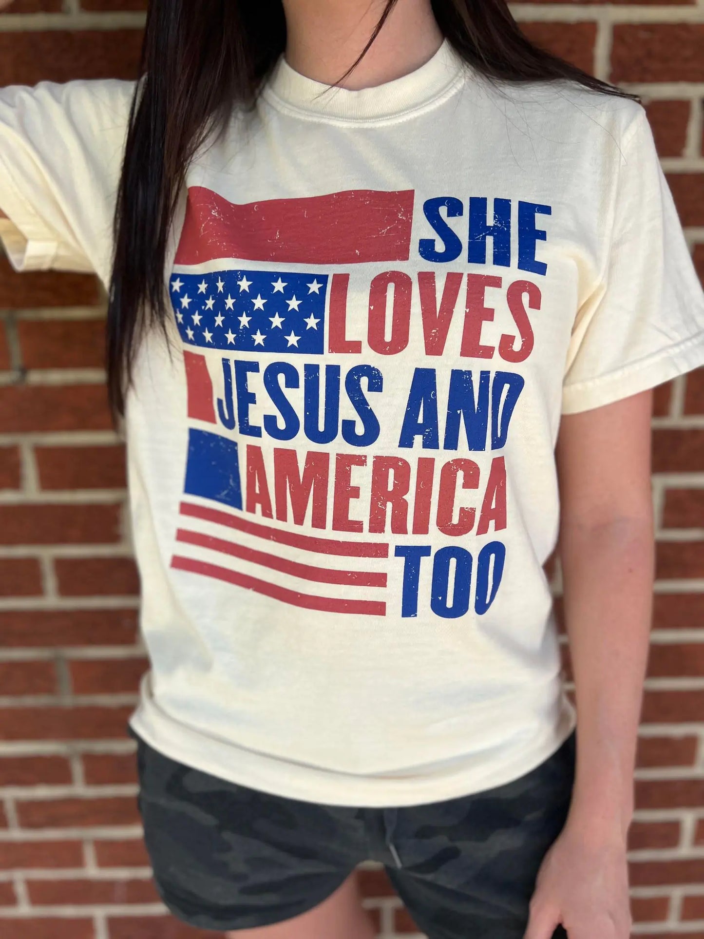 She Loves Jesus and America Too TeeAmerica and Jesus, that's all we need! This comfy tee is the perfect top for any patriotic holiday!

Model is wearing a size Small, her true size.Loves Jesus
