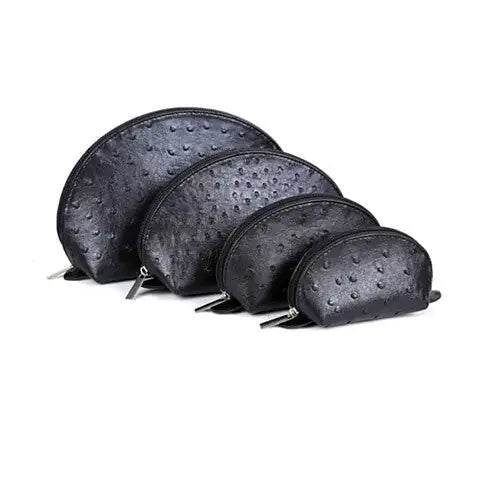 COSMO Cosmetic Faux Ostrich Cases In Set of 4Carry all your makeup essentials in the COSMO Cosmetic Faux Ostrich Cases in Set of 4 and be a true Cosmopolitan traveler in the real sense of the term!  
The COSMO COSMO Cosmetic Faux Ostrich Cases