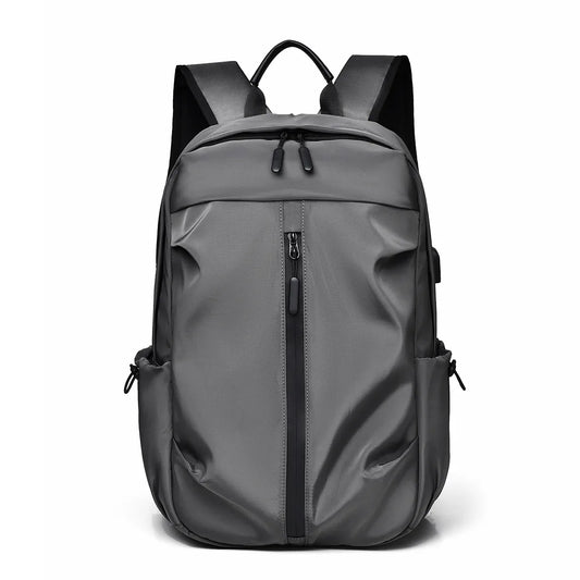Large capacity stylish grey backpack for men and women, made of lightweight Oxford cloth, suitable for commuting and carrying a computer.